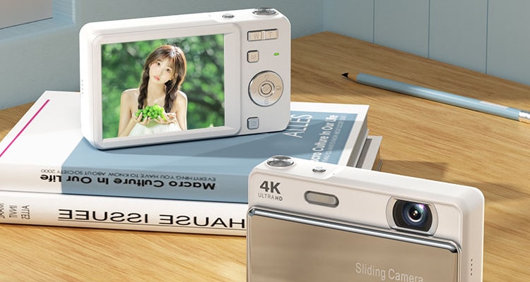 Two M15 cameras on a desk, one standing with its rear screen facing out